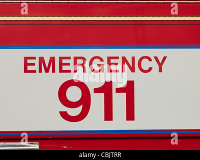 Emergency sign on side of the fire truck. Stock Photo