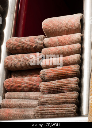 Fire hoses folded in fire truck. Stock Photo