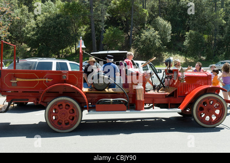 people visiting the antique 1940's year restored firefighters truck on parade in California, USA Stock Photo