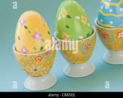 Painted easter eggs in egg cups. Stock Photo