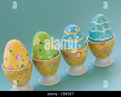 Painted easter eggs in egg cups. Stock Photo