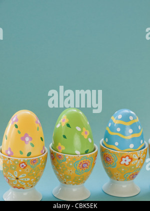Painted easter eggs in egg cups. Stock Photo