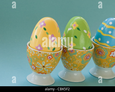 Painted easter eggs in egg cups. Stock Photo