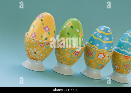 Painted easter eggs in egg cups. Stock Photo