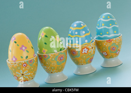 Painted easter eggs in egg cups. Stock Photo