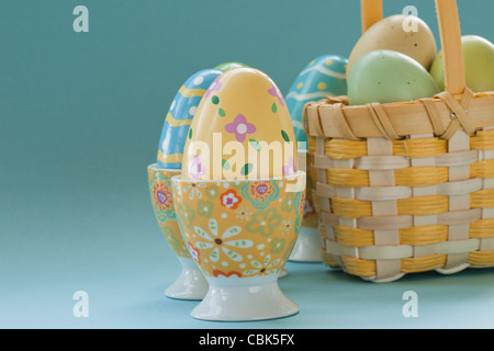 Painted easter eggs in egg cups. Stock Photo