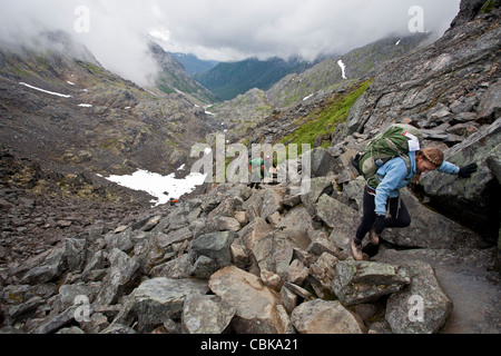 Young women ascending the Golden Stairs. Chilkoot Pass. Chilkoot Trail. Klondike Gold Rush Historical Park. Alaska. USA Stock Photo