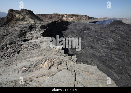 South pit crater filled by basaltic lava flows with inactive hornito to left, Erta Ale volcano, Danakil Depression, Ethiopia. Stock Photo