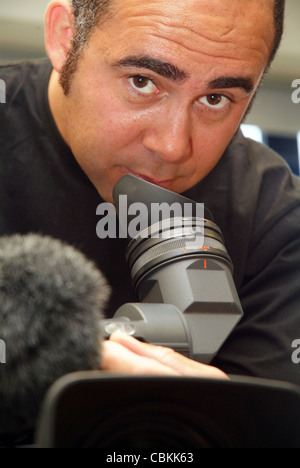 Nick Porter, cameraman for Al Jazeera English doing maintenance on ...