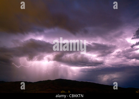 Lightning strikes during a thunderstorm on the first day of summer in Boise, Idaho, USA. Stock Photo