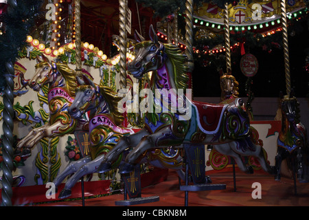 a close up of horses on a funfair carousel Stock Photo