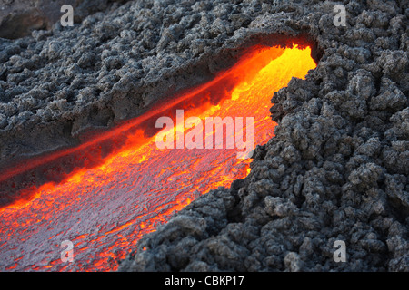 December 23, 2007 - Lava flowing from small tunnel on flank of Pacaya volcano, Guatemala.