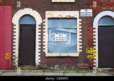 'All Ball Games Prohibited' Two-up two-down Boarded Up house and sealed empty Terraced Property in Anfield, Liverpool L5,  Merseyside, UK Stock Photo