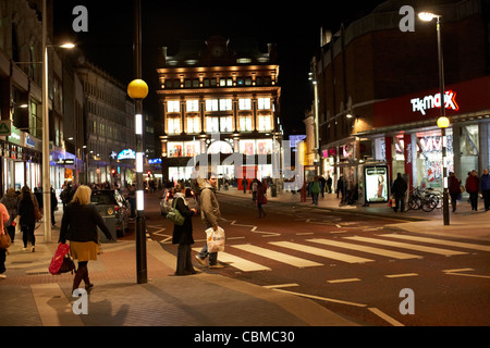 shoppers crossing pedestrian crossing in castle place belfast northern ireland uk united kingdom Stock Photo