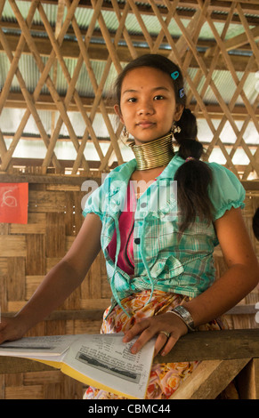 Mo Ji, one of the last young Padaung (Longneck Karen) girls to wear the brass coils, in Ban Nai Soi, Thailand