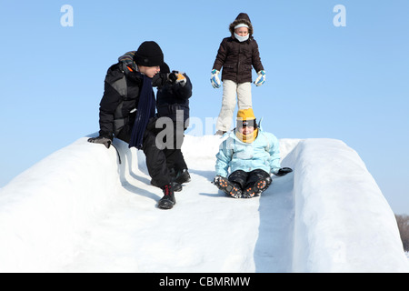 Children ice sliding, Harbin ice festival Stock Photo