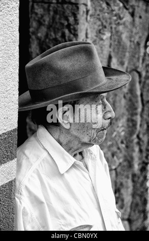 Local humble poor man portrait with cowboy hat in Lake Atitlan village of San Pedro Guatemala in Central America Stock Photo