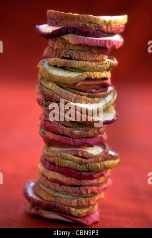Apple chips dried apple rings, stacked to a tower Stock Photo