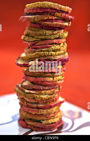 Apple chips dried apple rings, stacked to a tower Stock Photo