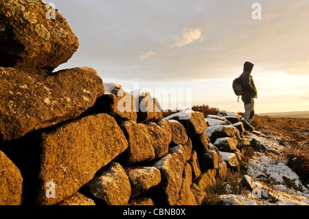 Sunrise hitting a gritstone wall at Baslow Edge Peak District Stock Photo