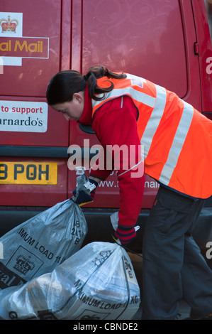 Post woman at work in Cambridge, England. Stock Photo