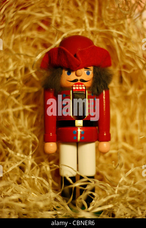 A traditional German wood-carved nutcracker produced in the Ore Mountains, Germany. Stock Photo