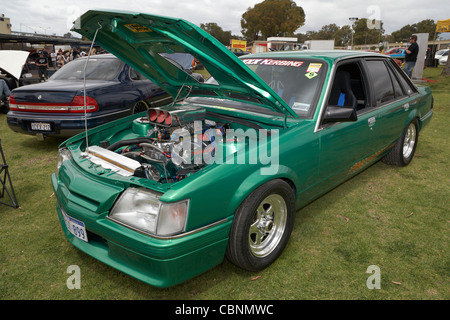 Heavily modified and customised Australian Holden Commodore on display at an outdoors Aussie car show. Stock Photo