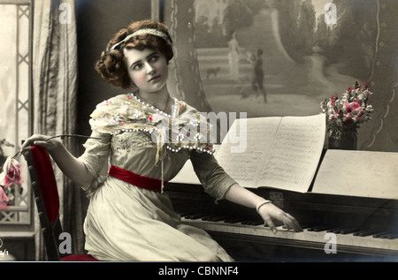 Pensive Young Beauty at the Piano Stock Photo