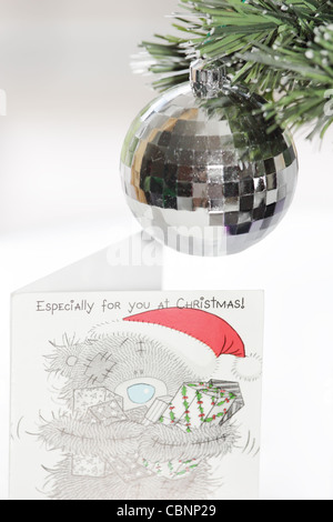 A Cute Christmas Card, Ornament, Silver Ball and Fibre Optic Christmas Tree Stock Photo
