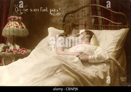 Passionate Couple Kissing in Bed Stock Photo