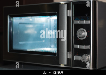 details of modern microwave oven in the kitchen Stock Photo
