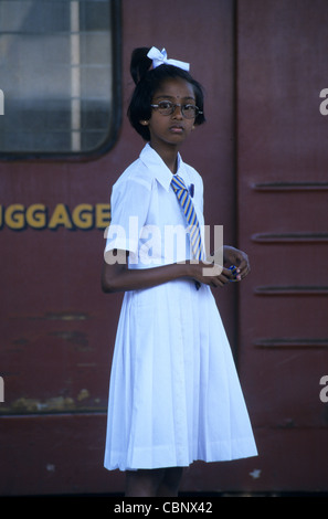 School girl in uniform, Railway station, Kandy, Sri Lanka Stock Photo