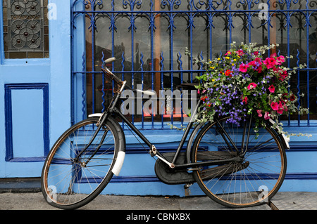 frontal front view tynans bridge house bar pub licensed premises kilkenny ireland blue attraction bike bicycle flower basket Stock Photo