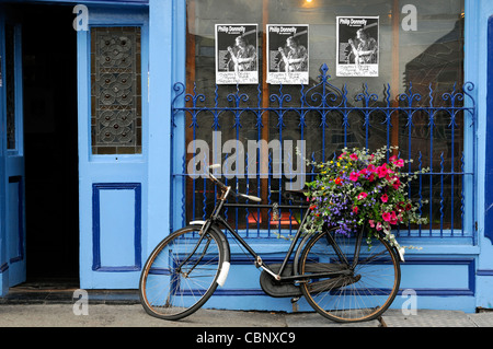 frontal front view tynans bridge house bar pub licensed premises kilkenny ireland blue attraction bike bicycle flower basket Stock Photo