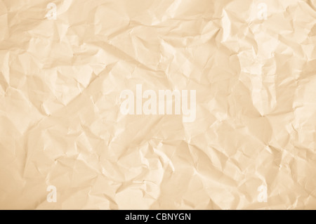 crumpled sheet of yellow paper background with rich detail Stock Photo