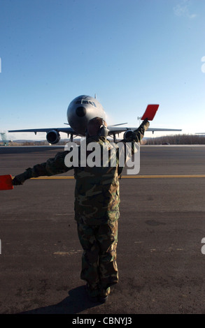 Staff Sgt. Martin Walker marshals a KC-10 Extender April 13 at Eielson Air Force Base, Alaska, during Red Flag-Alaska 07-1. This aircraft supports Red Flag-Alaska by performing aerial refueling allowing longer flight time for fighter jets conducting simulated air combat training missions over the Pacific Alaskan Range Complex. Sergeant Walker is assigned to the 305th Maintenance Squadron at McGuire AFB, N.J. Stock Photo