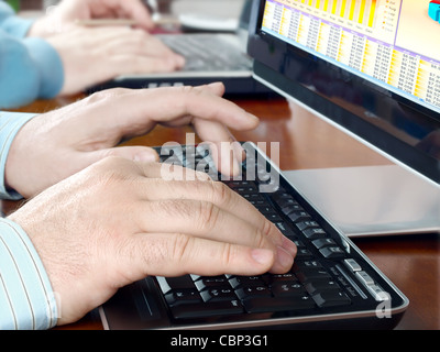 Hands typing on computer keyboard Stock Photo
