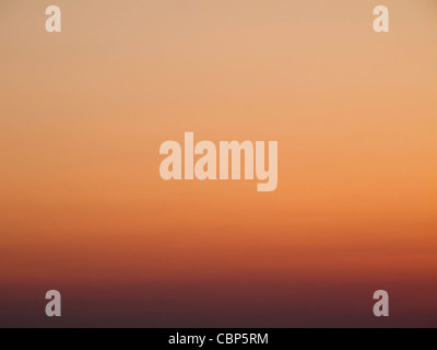 Colorful sky after sunset, background color gradient from orange to magenta Stock Photo