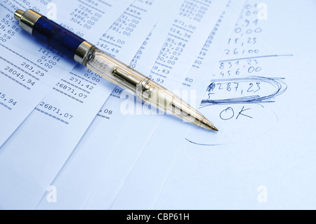 Prints of financial report on a sheets and pen Stock Photo