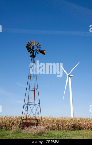 Old fashioned Windmill and Wind Turbine in corn field Indiana USA Stock Photo