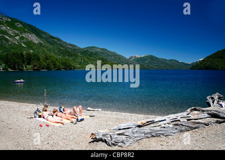 People bathing by a Falkner lake in the lakes region near Bariloche, Patagonia. Argentina. Stock Photo