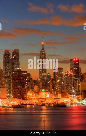 The Empire State Building during morning twilight as viewed over the Hudson River looking east from New Jersey. Stock Photo