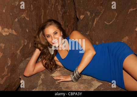 Jessica Martin, Miss New Mexico 2012 posing in blue mini dress in a cave like setting Stock Photo