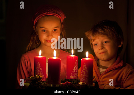 young children looking at an Advent wreath Stock Photo