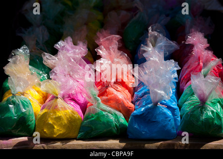 Bags of powder colours on sale for traditional Hindu Holi festival in old town Udaipur, Rajasthan, Western India Stock Photo