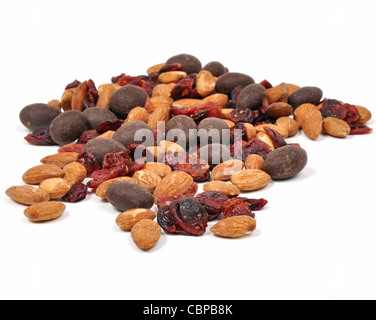 Closeup of a snack consisting of nuts, dried fruit and chocolate on a white background Stock Photo