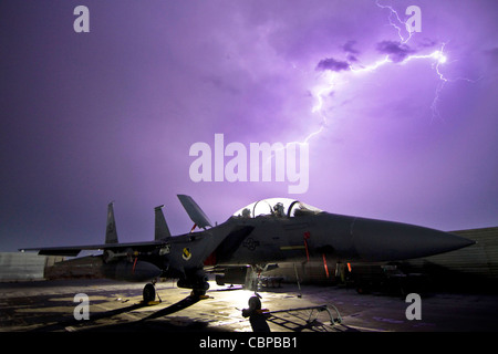 A U.S. Air Force F-15E Strike Eagle is illuminated by a lightning storm near Bagram Air Field, Afghanistan, on Oct. 6, 2011. Stock Photo