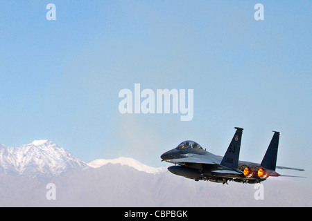 An F-15E Strike Eagle roars off into the Afghan sky Oct. 6. 2011. F-15s help provide residual base defense. Bagram Airfield is a joint installation, but its security is unusual in that defending the base is performed primarily by Airmen. Airmen from the 455th Air Expeditionary Wing are hard at work each and every day fulfilling the wings mission: Support the fight, defend the base and win. Stock Photo