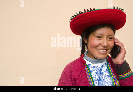 Modern life in Peru woman in traditional dress and hat with cell phone communicating via wireless Stock Photo