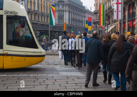 People crossing the street at Piazza Cordusio central Milan Lombardy region Italy Europe